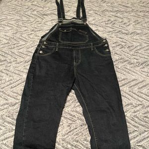 Denim overalls. Dark wash. Slim fit.